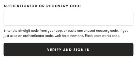 Authenticator or recovery code field and Verify and sign in button.
